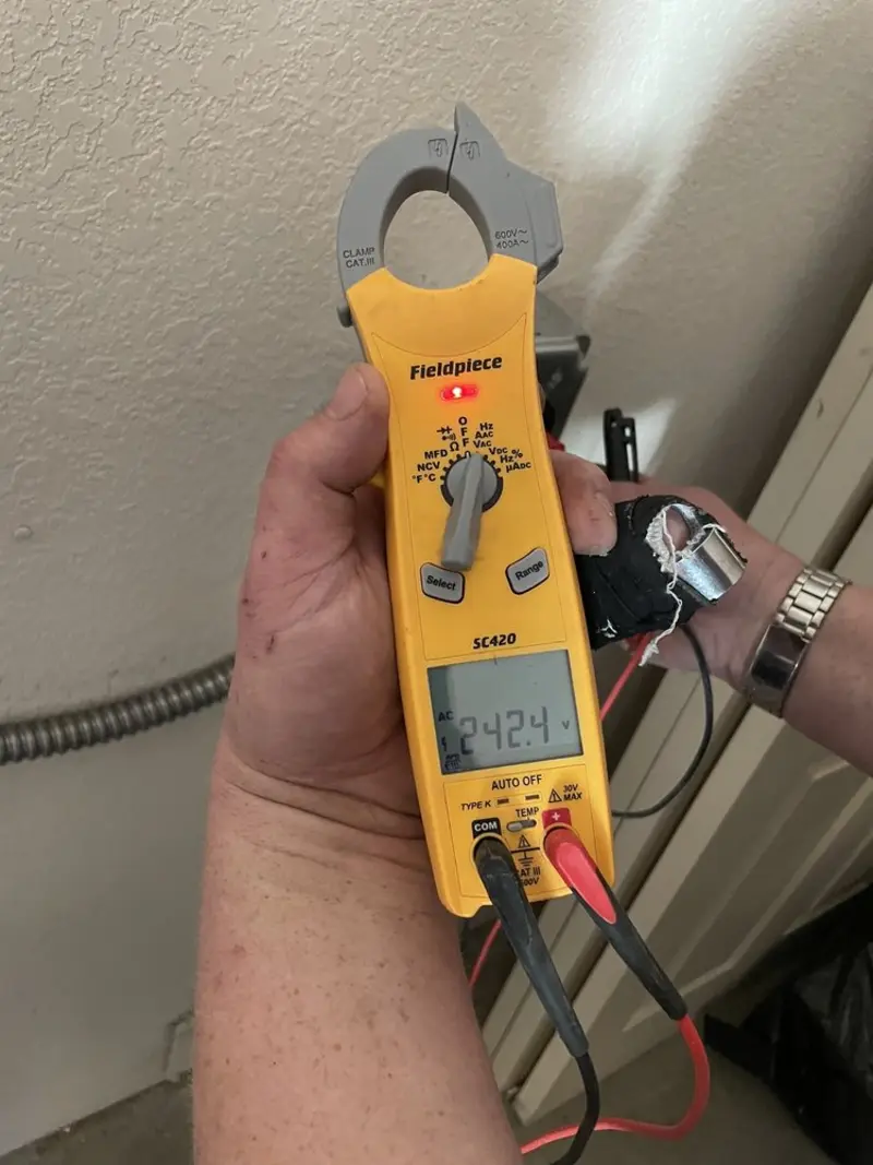 Voltage testing with clamp meter during Ceiling Fan Installation in Glen Rose